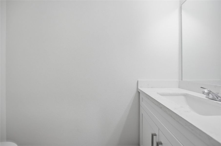 Half Bath inside the home.  (This home has two 1/2 baths - one outside off the covered patio and one inside)