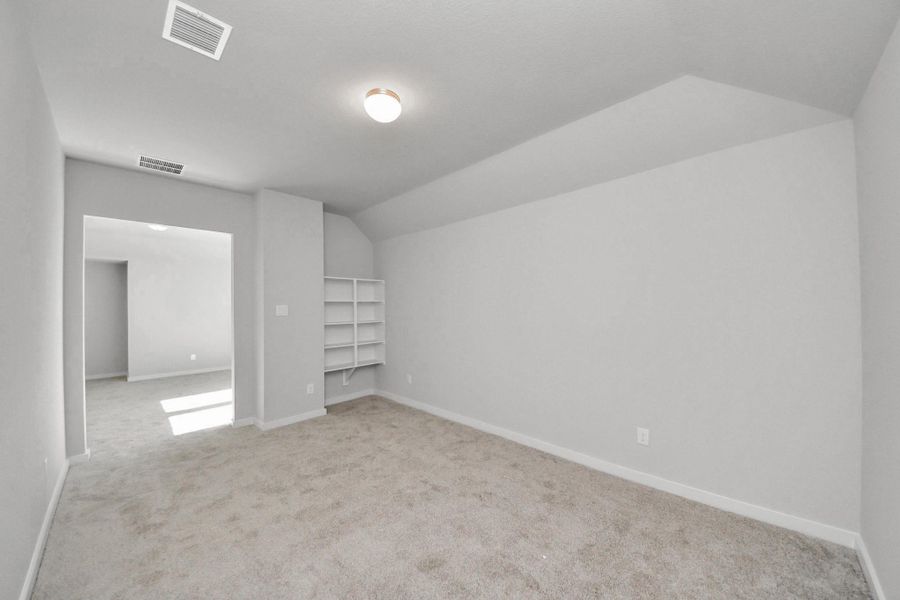 Take a look at this spacious media room, perfect for movie nights!
