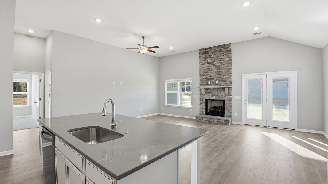 looking at the gas log fireplace from the kitchen