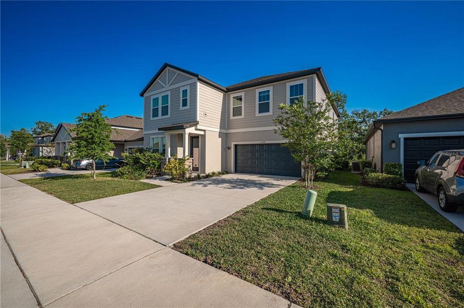 Front exterior of a new home in , Orlando, FL, highlighting curb appeal (Image 1). Front exterior of a new home in , Orlando, FL, highlighting curb appeal (Image 1).