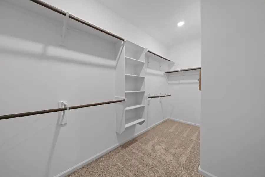 Step right into your spacious walk-in closet, conveniently located inside the primary bathroom. It makes mornings smoother, evenings more relaxed, and overall daily living just a little easier.
