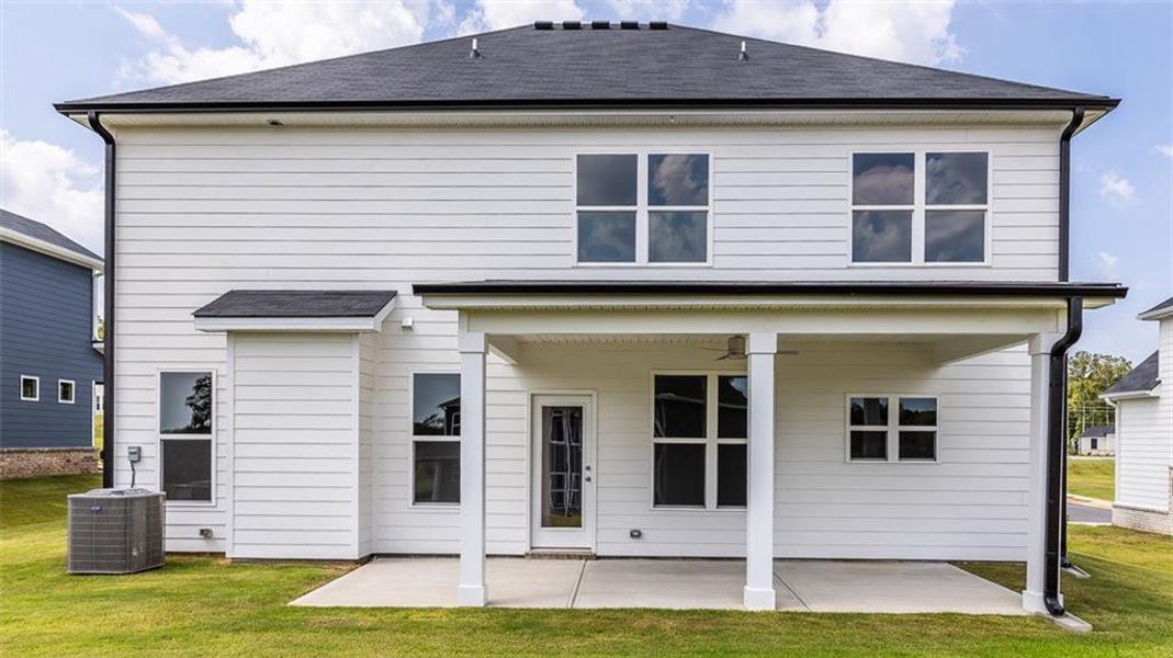 Exterior details and patio area of a home in Evergreen Crossing, Locust Grove (Image 2).
