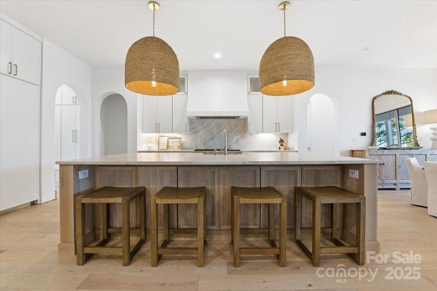 Oversized Kitchen island features additional cabinetry storage and the pull up bar stool seating. Oversized Kitchen island features additional cabinetry storage and the pull up bar stool seating.