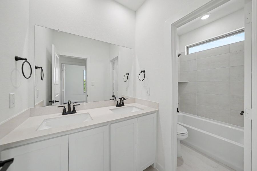 Furnished interior view inside a new home in Light Farms Brenham - 40' Lots, Celina (Image 11).