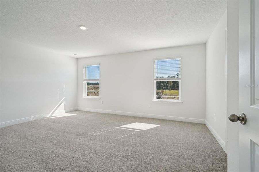 Spacious, unfurnished interior of a new home in The Reserve at Hammock Oaks - Signature Series, Lady Lake (Image 29).