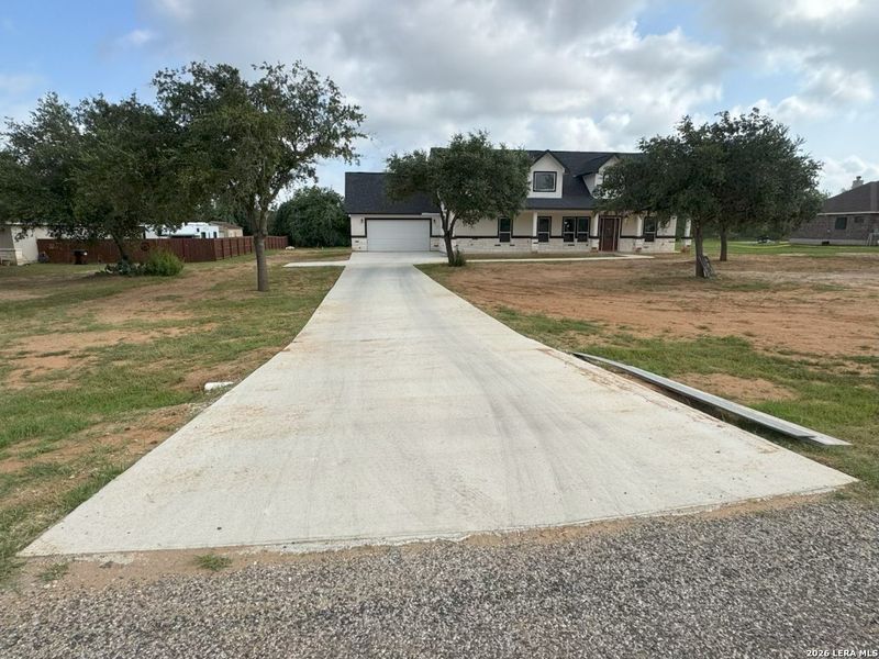 Front exterior of a new home in , Lytle, TX, highlighting curb appeal (Image 20). Front exterior of a new home in , Lytle, TX, highlighting curb appeal (Image 20).