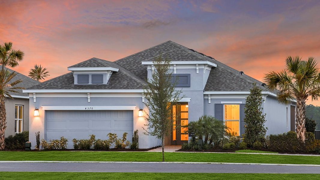 Representative exterior photo of a completed home built from the Lazio by Taylor Morrison in Esplanade at Westview, Kissimmee, FL (Image 18).