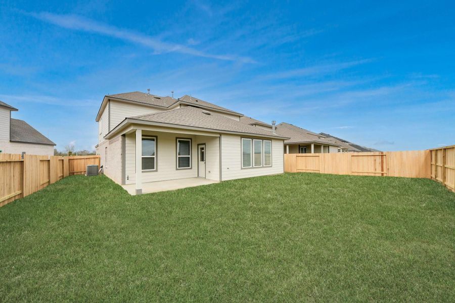 Backyard retreat, offering an abundance of space for kids to play and explore. The possibilities are endless in this outdoor haven, where the joy of open-air activities and family gatherings awaits.