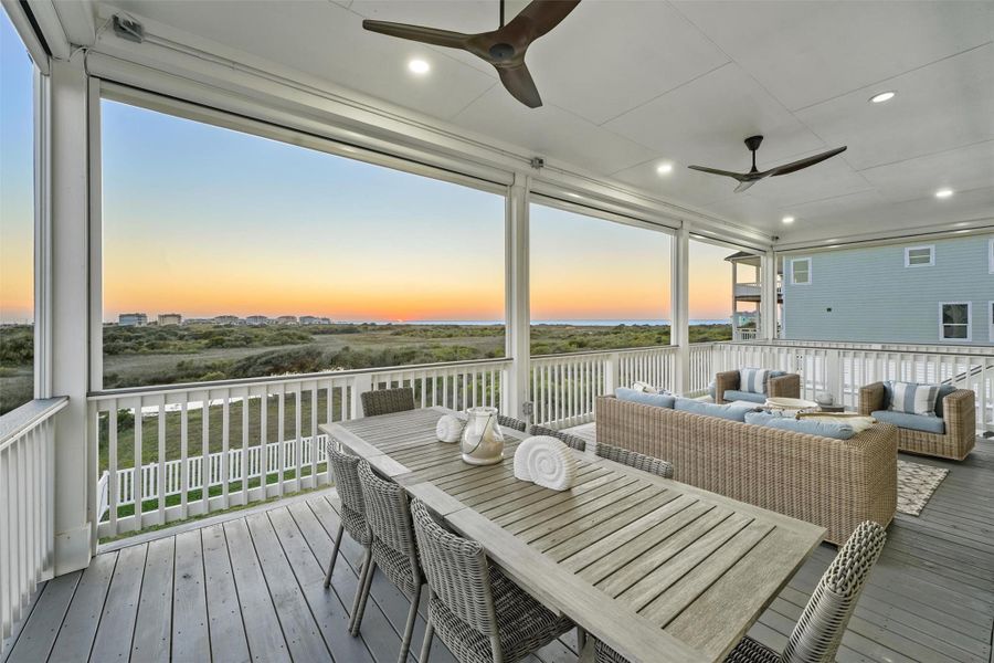 Luxury inside and out! Enjoy outdoor dining on posh Pottery Barn table and chairs for eight, offering stunning sunset views. Ideal for relaxation and entertaining.