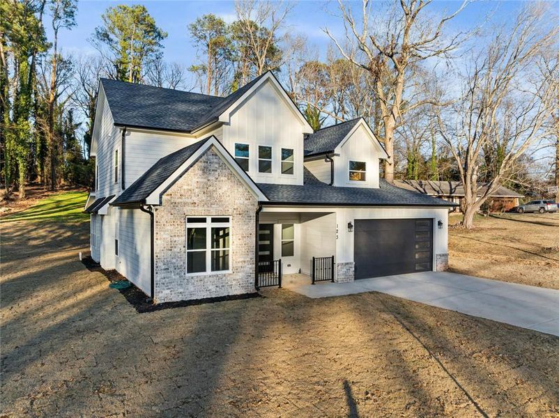 Front exterior of a new home in , Lawrenceville, GA, highlighting curb appeal (Image 23).