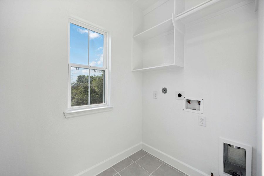A laundry room you’ll actually want to use. Built-in shelving, hanging space, and even a window to make chores feel just a little lighter. A laundry room you’ll actually want to use. Built-in shelving, hanging space, and even a window to make chores feel just a little lighter.