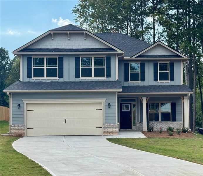 Front exterior of a new home in Magnolia Villas, Cornelia, GA, highlighting curb appeal (Image 16). Front exterior of a new home in Magnolia Villas, Cornelia, GA, highlighting curb appeal (Image 16).