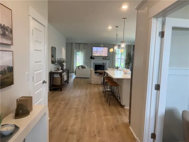 Gleaming wood floors guide the eye through this op