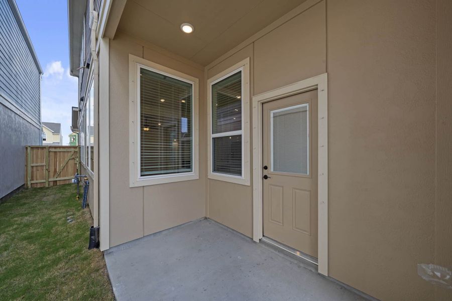 Exterior details and patio area of a home in Meridiana, Manvel (Image 19).