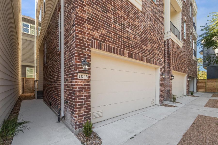 2-car attached garage and side-yard that could easily be turfed!