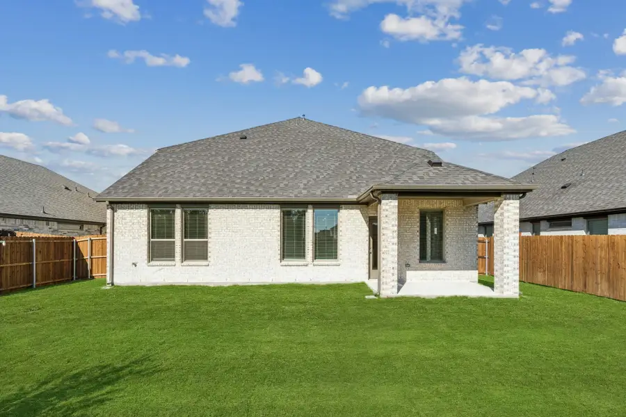 Covered Patio in the Winters home plan by Trophy Signature Homes – REPRESENTATIVE PHOTO
