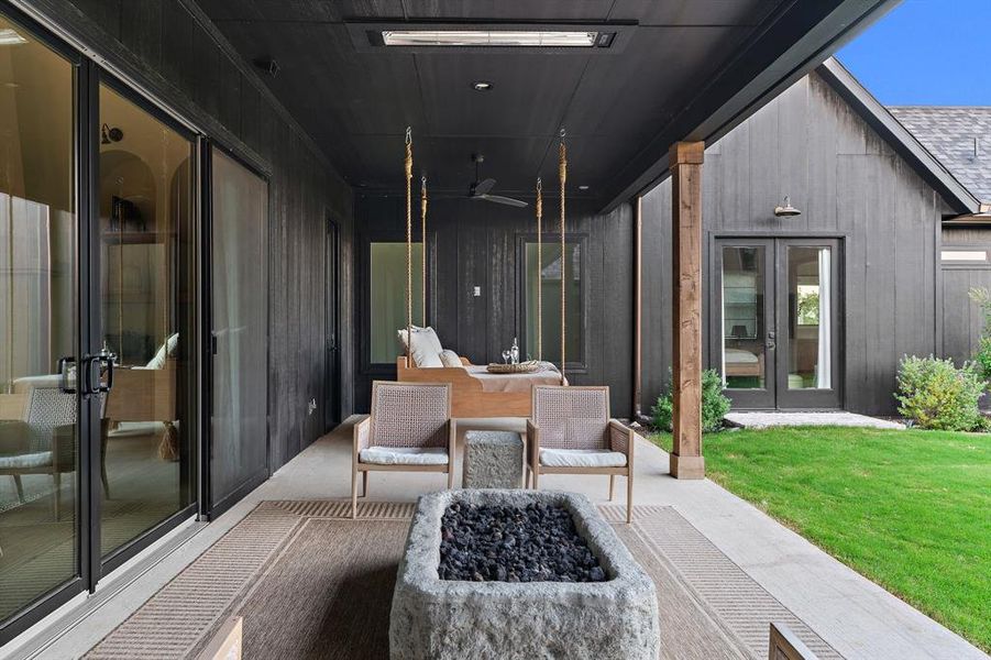 View of patio with french doors and ceiling fan