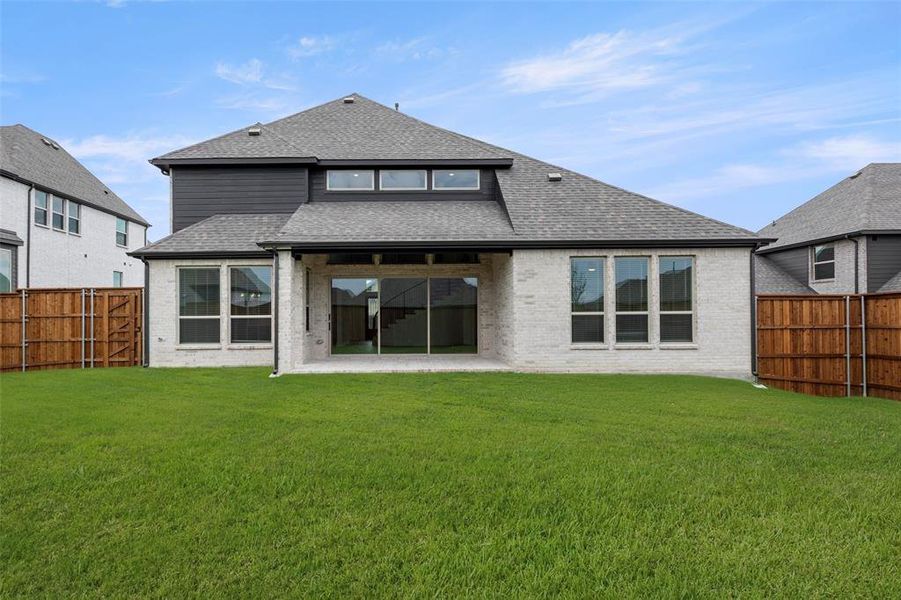 Front exterior of a new home in Cambridge Estates, Prosper, TX, highlighting curb appeal (Image 2).