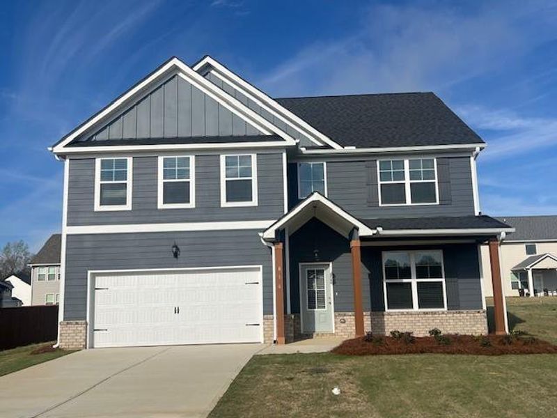 Front exterior of a new home in , Bonaire, GA, highlighting curb appeal (Image 1). Front exterior of a new home in , Bonaire, GA, highlighting curb appeal (Image 1).