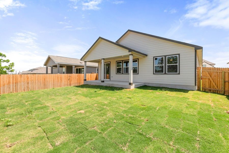 Exterior details and patio area of a home in Hickory Ridge, Elmendorf (Image 3).