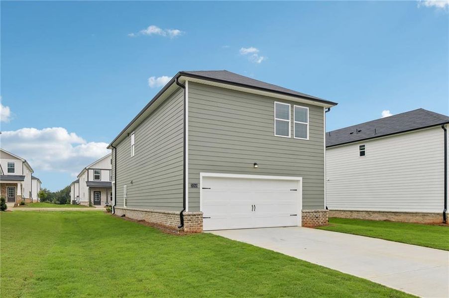 Front exterior of a new home in Martin Springs - Cottage Series, Lawrenceville, GA, highlighting curb appeal (Image 23).