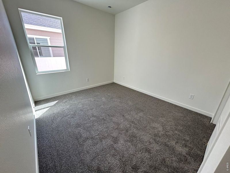 Spacious, unfurnished interior of a new home in Union Colony West, Greeley (Image 11).