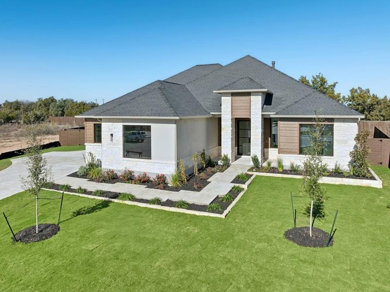 Front exterior of a new home in Riverstone, Georgetown, TX, highlighting curb appeal (Image 23).