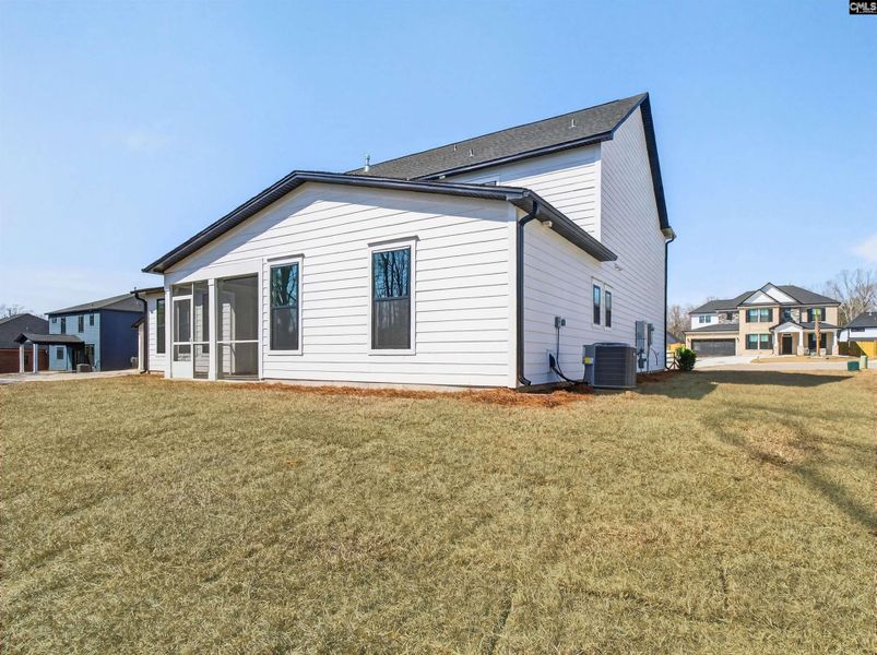 Exterior details and patio area of a home in Collins Cove, Chapin (Image 29).