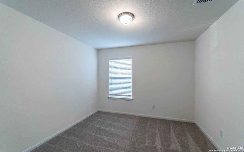 Spacious, unfurnished interior of a new home in Hunter's Ranch, San Antonio (Image 15).