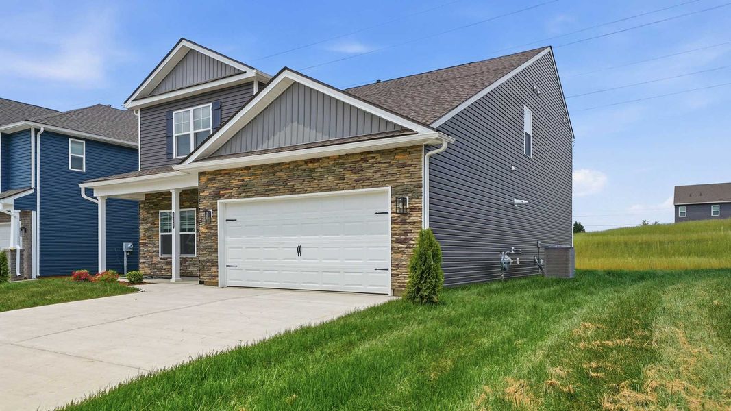 Front exterior of a new home in Fieldcrest Acres, Blountville, TN, highlighting curb appeal (Image 20). Front exterior of a new home in Fieldcrest Acres, Blountville, TN, highlighting curb appeal (Image 20).