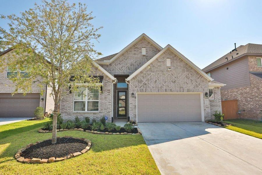 Front exterior of a new home in , Katy, TX, highlighting curb appeal (Image 1). Front exterior of a new home in , Katy, TX, highlighting curb appeal (Image 1).