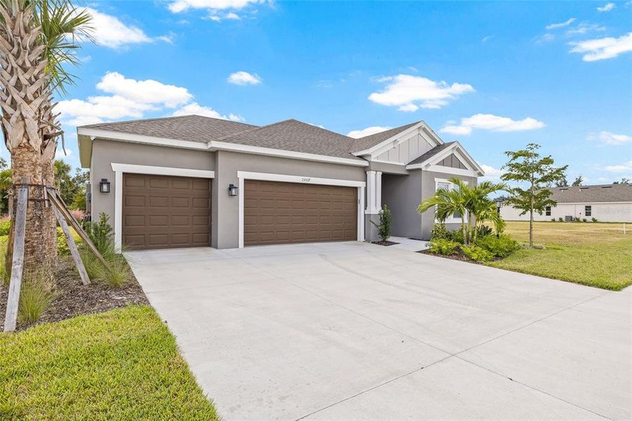 Front exterior of a new home in Tiburon, Nokomis, FL, highlighting curb appeal (Image 23).