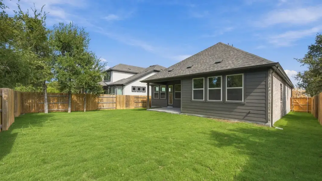 Exterior details and patio area of a home in Oaks at San Gabriel, Georgetown (Image 4).