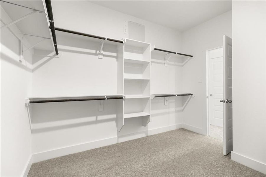 Spacious Walk In Closet w/ Built In Shelving