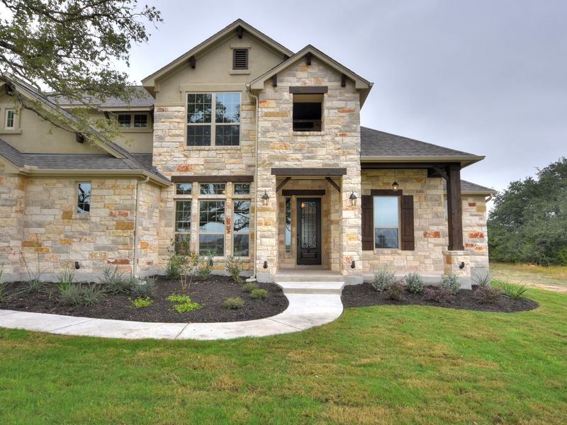 Representative exterior photo of a completed home built from the Madera II by Giddens Homes in Scofield Farms Estates, Georgetown, TX (Image 53).