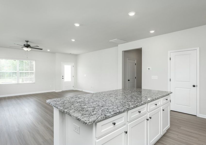The kitchen overlooks the living area