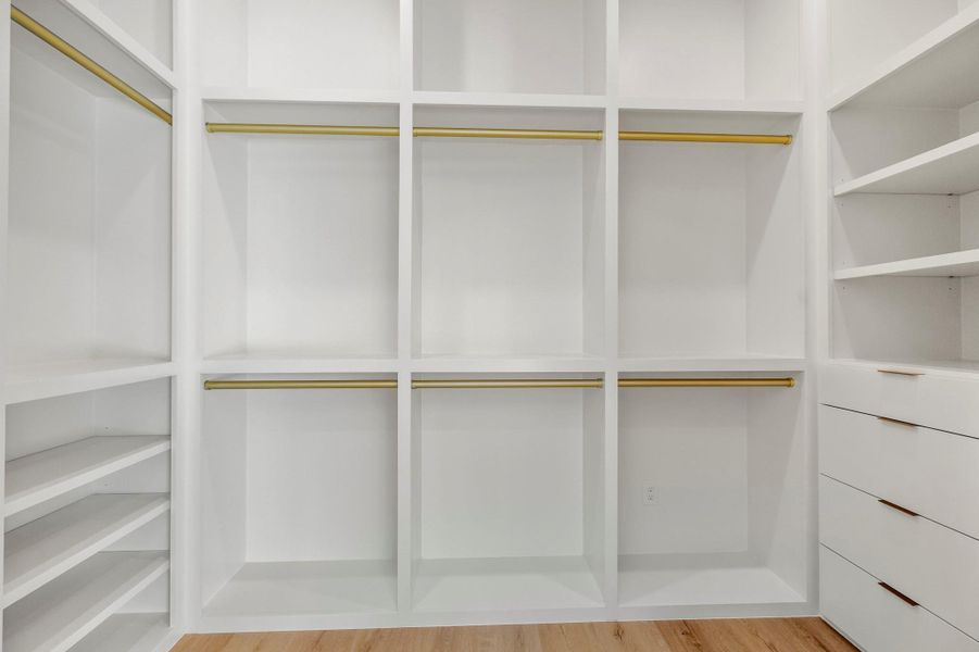 View of custom junior suite walk-in closet. View of custom junior suite walk-in closet.
