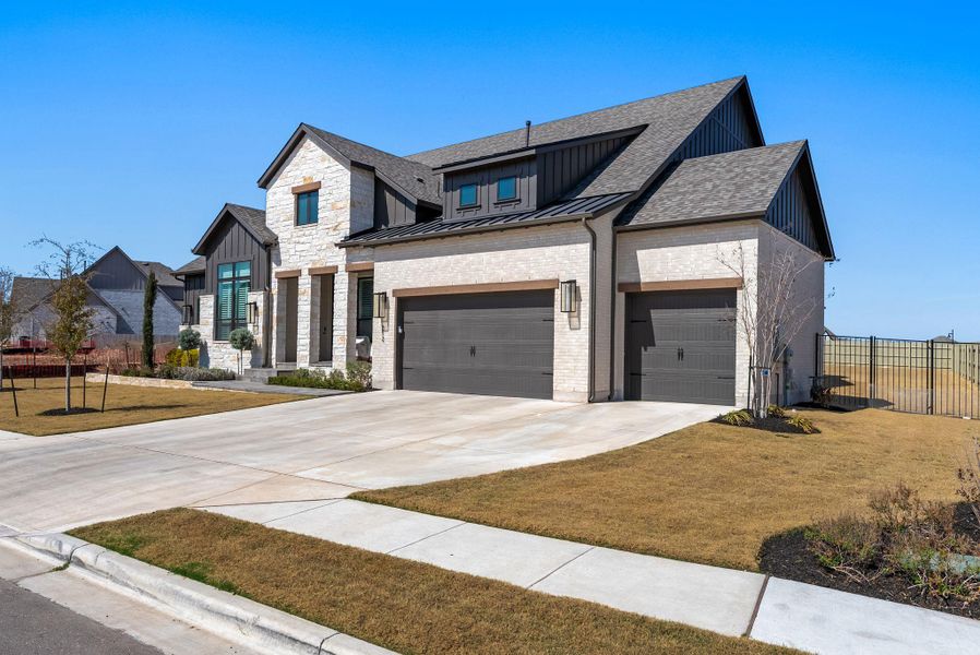 Front exterior of a new home in Santa Rita Ranch, Liberty Hill, TX, highlighting curb appeal (Image 22). Front exterior of a new home in Santa Rita Ranch, Liberty Hill, TX, highlighting curb appeal (Image 22).