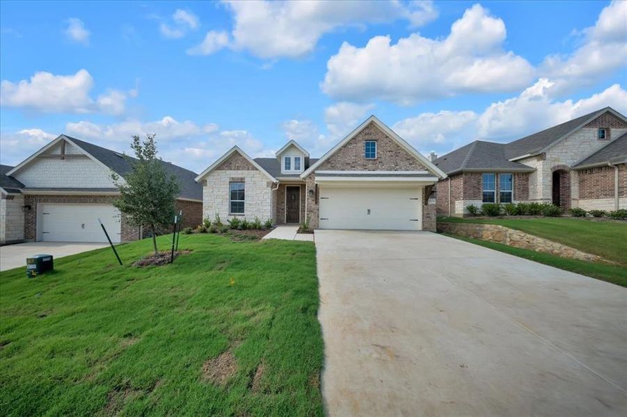 Front exterior of a new home in Liberty Pointe, Gainesville, TX, highlighting curb appeal (Image 23).