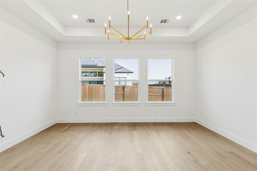 This dreamy owners suite combines high ceilings and oversized windows to create a relaxing and peaceful retreat.