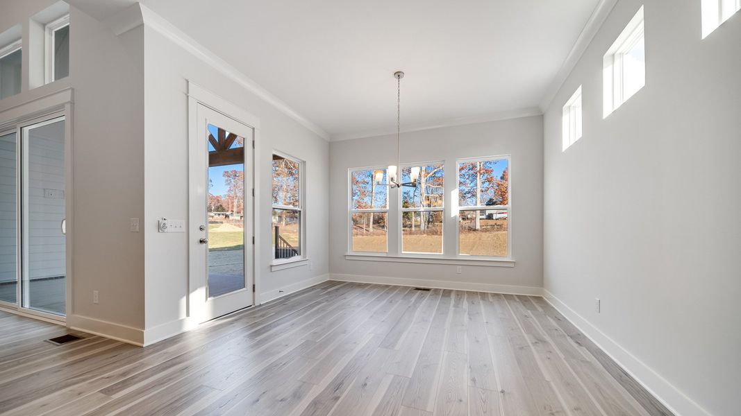 Open Dining area with large amount of natural light near the kitchen