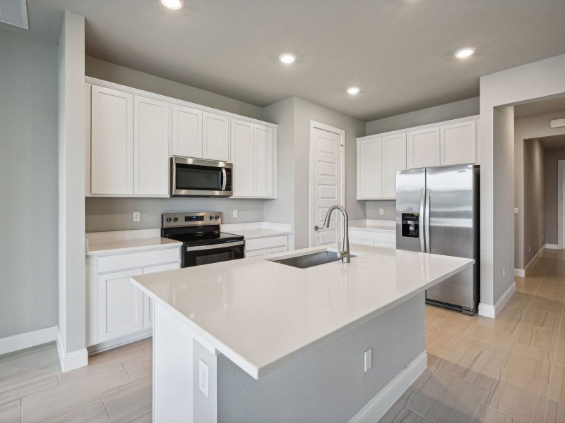 Kitchen in the Bergamo floorplan at 8984 Dahlia Circle