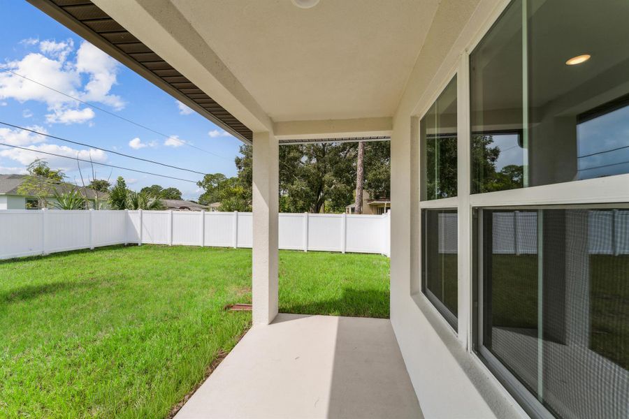 Exterior details and patio area of a home in Aspire at Palm Bay, Palm Bay (Image 27).