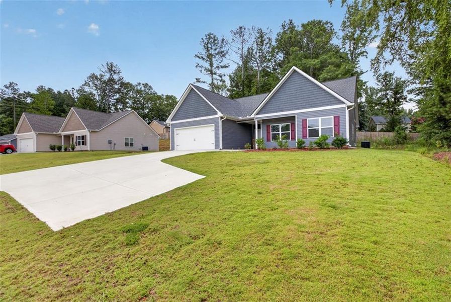 Front exterior of a new home in , Dallas, GA, highlighting curb appeal (Image 22). Front exterior of a new home in , Dallas, GA, highlighting curb appeal (Image 22).