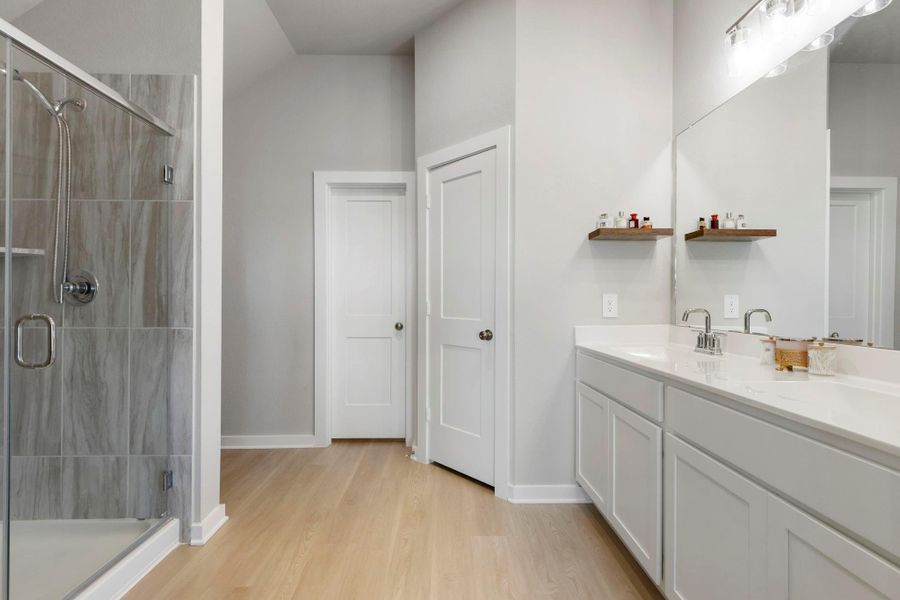 Walk-in shower in the primary suite.