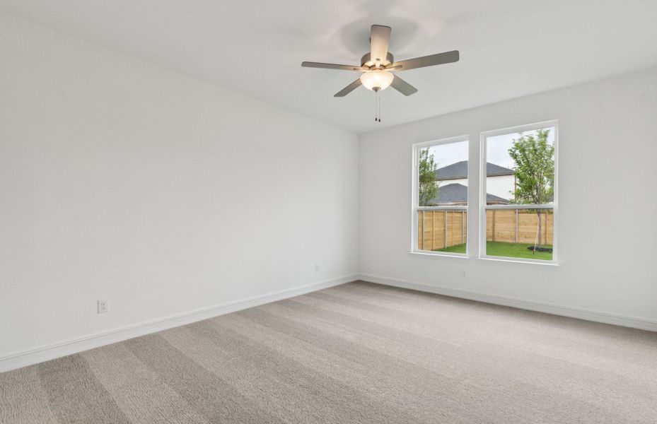 Spacious owner's suite bathed in natural light  *Real home pictured