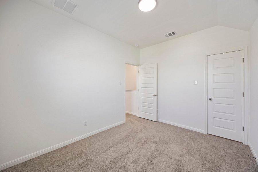 Bedroom in the Magnolia home plan by Trophy Signature Homes – REPRESENTATIVE PHOTO