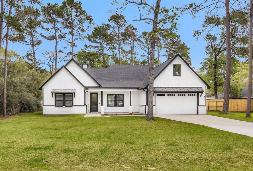 Front exterior of a new home in , Magnolia, TX, highlighting curb appeal (Image 23).