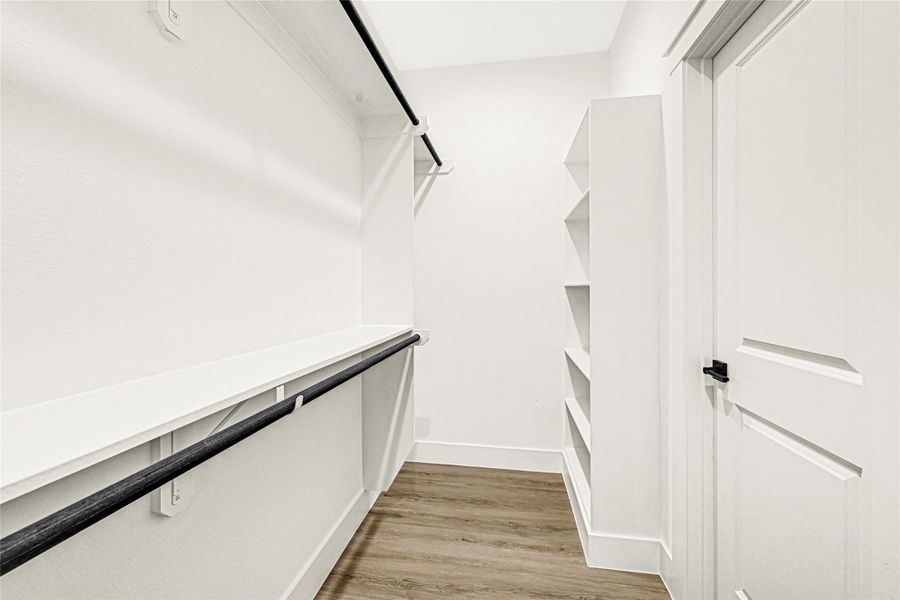 Primary walk in closet Primary walk in closet
