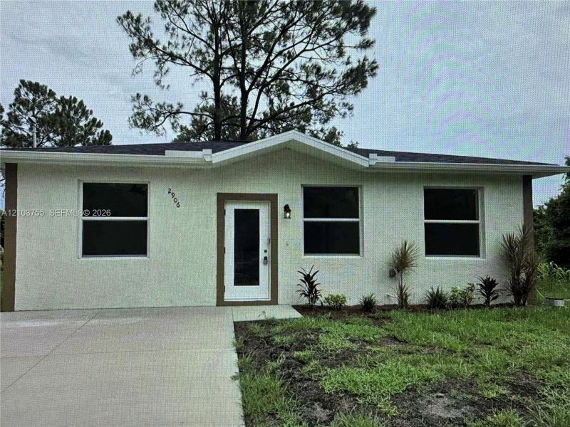 Front exterior of a new home in , Lehigh Acres, FL, highlighting curb appeal (Image 1). Front exterior of a new home in , Lehigh Acres, FL, highlighting curb appeal (Image 1).